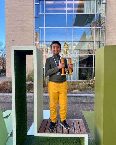 CHESS KLUB Student with Trophy
