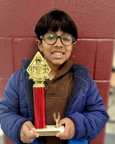 CHESS KLUB Student with Trophy